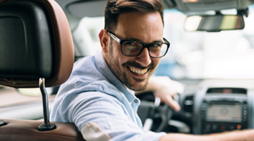 man backing up vehicle
